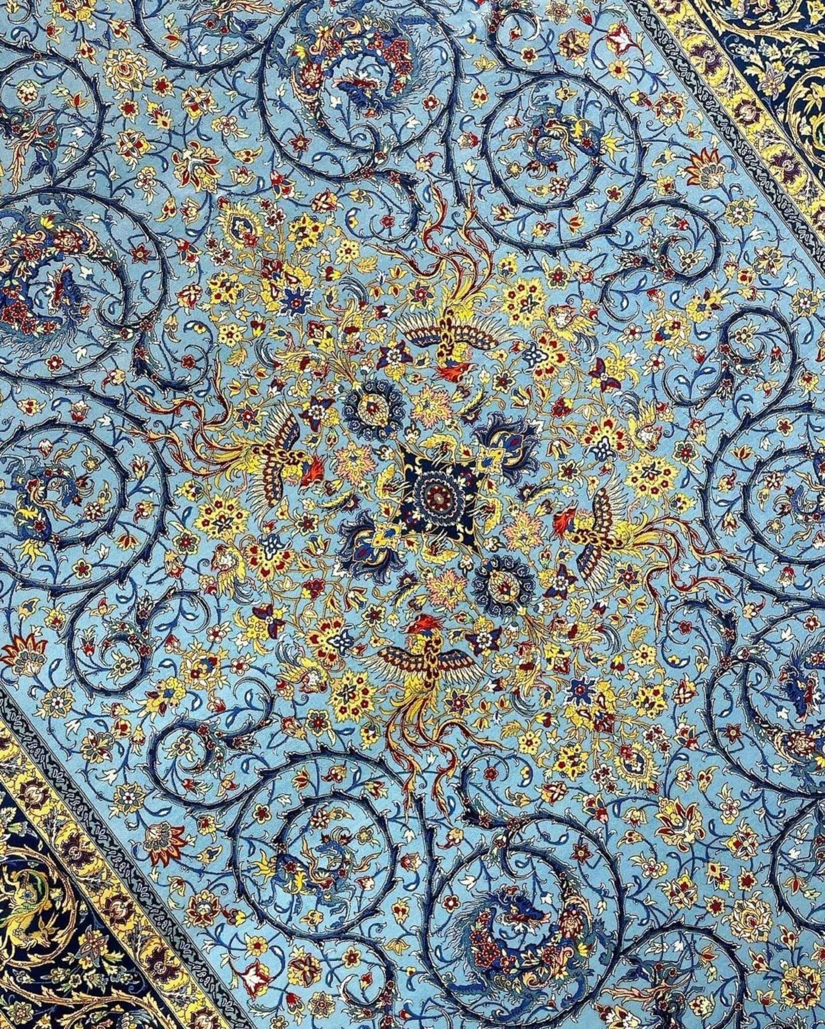 Hand-knotted blue Persian rug from Isfahan, made of wool and silk